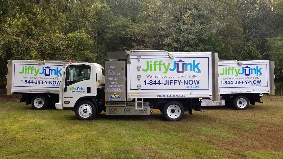 A collection of Jiffy Junk removal trucks, that our company uses for commercial junk removal.
