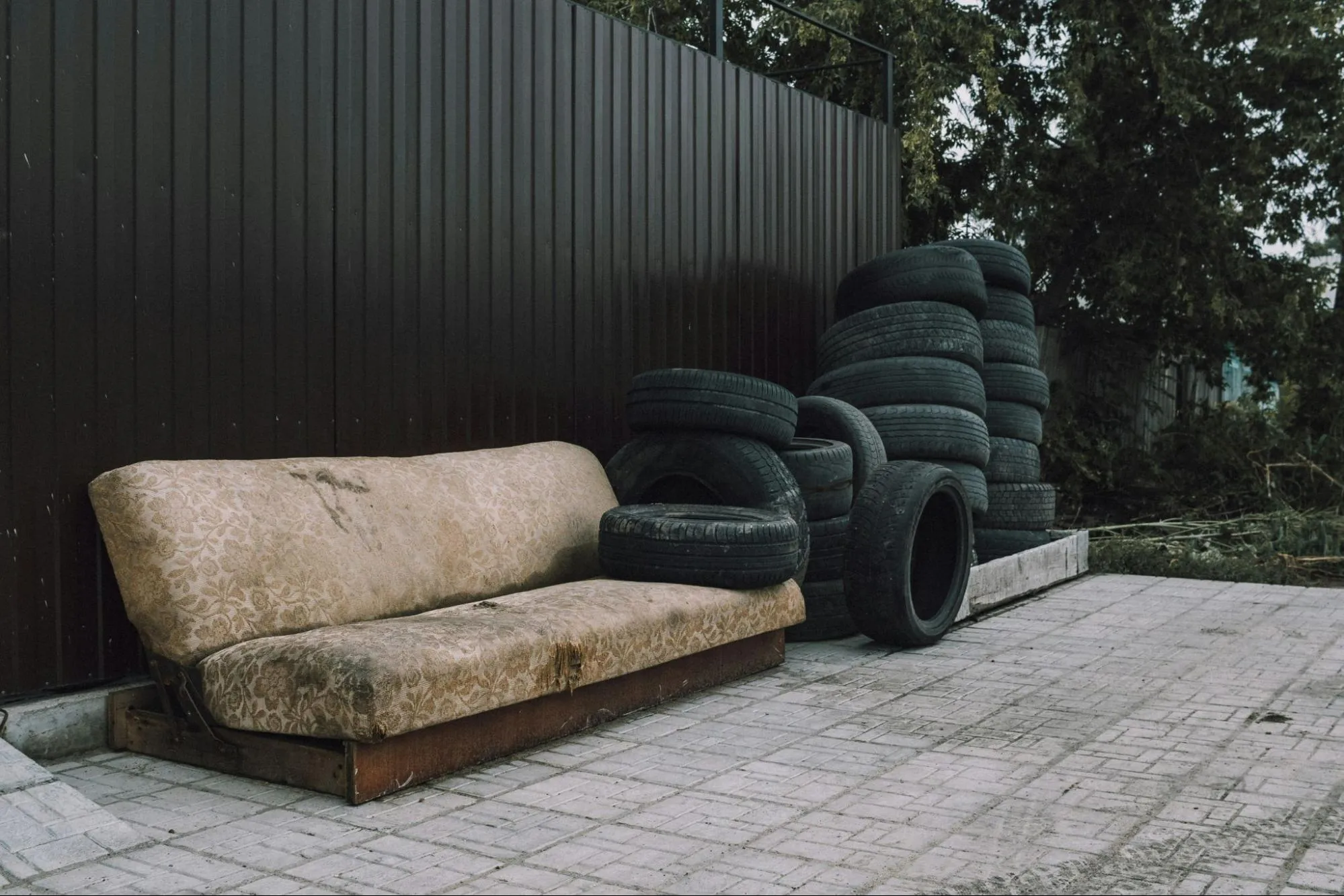 Black car tires on brown couch