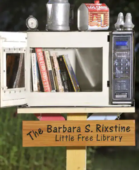 Repurposing an old microwave into a library.