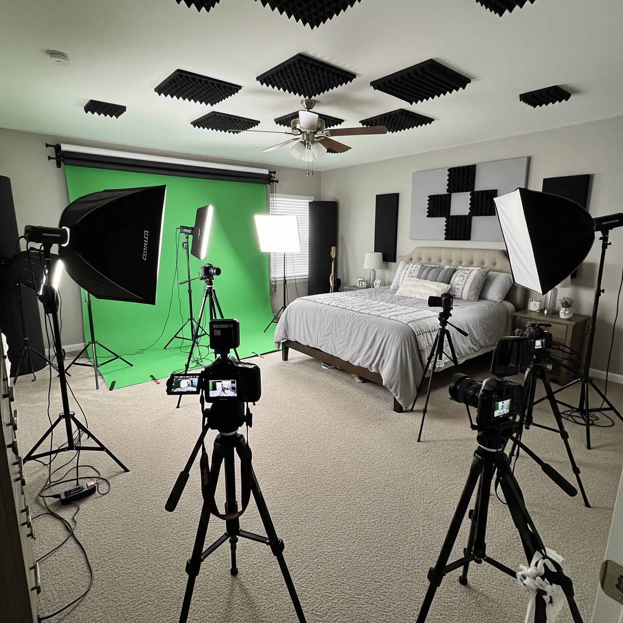 Set up a bedroom that doubles as a content creation studio with professional lighting equipment, green screen capabilities, acoustic treatment, and multiple camera angles.