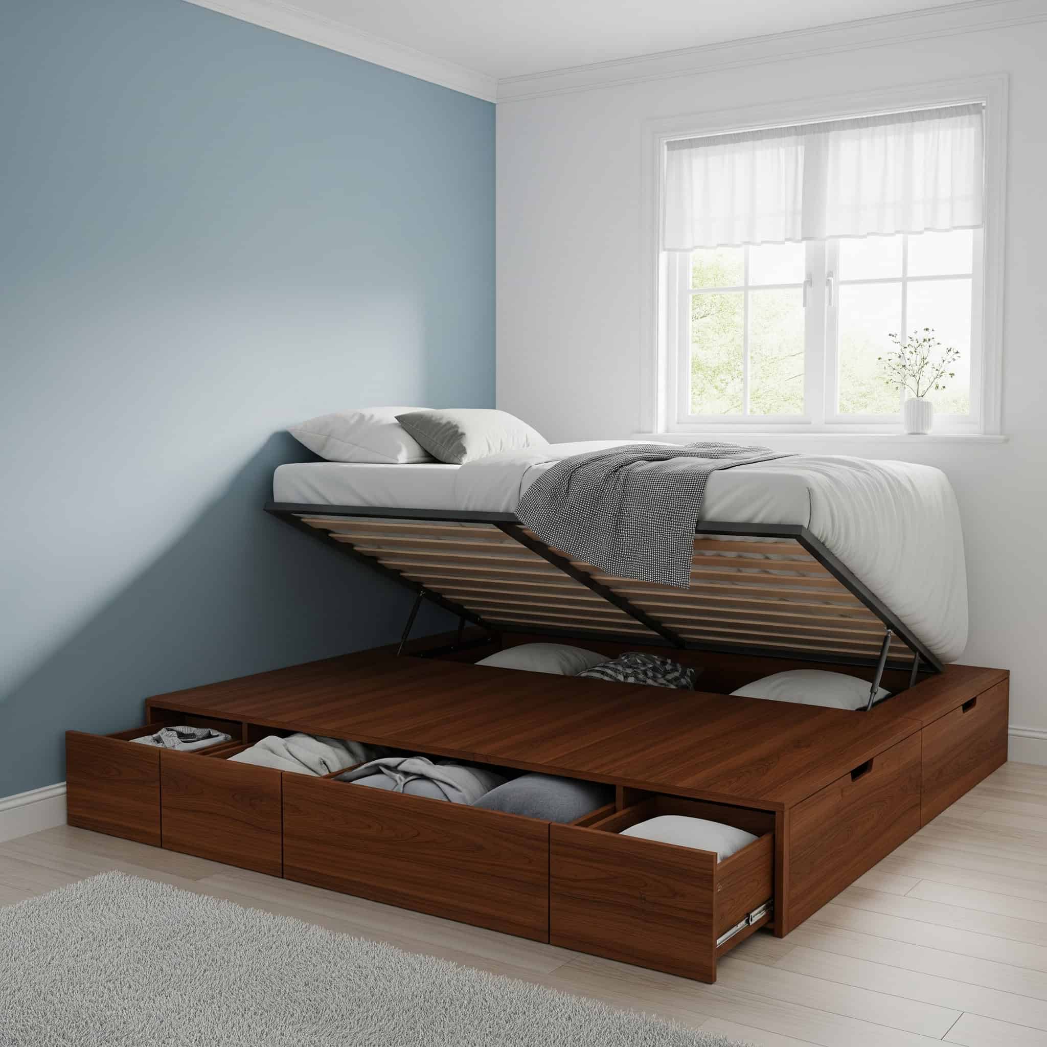  A platform bed with built-in storage drawers and a hydraulic lift mechanism in a small bedroom.






