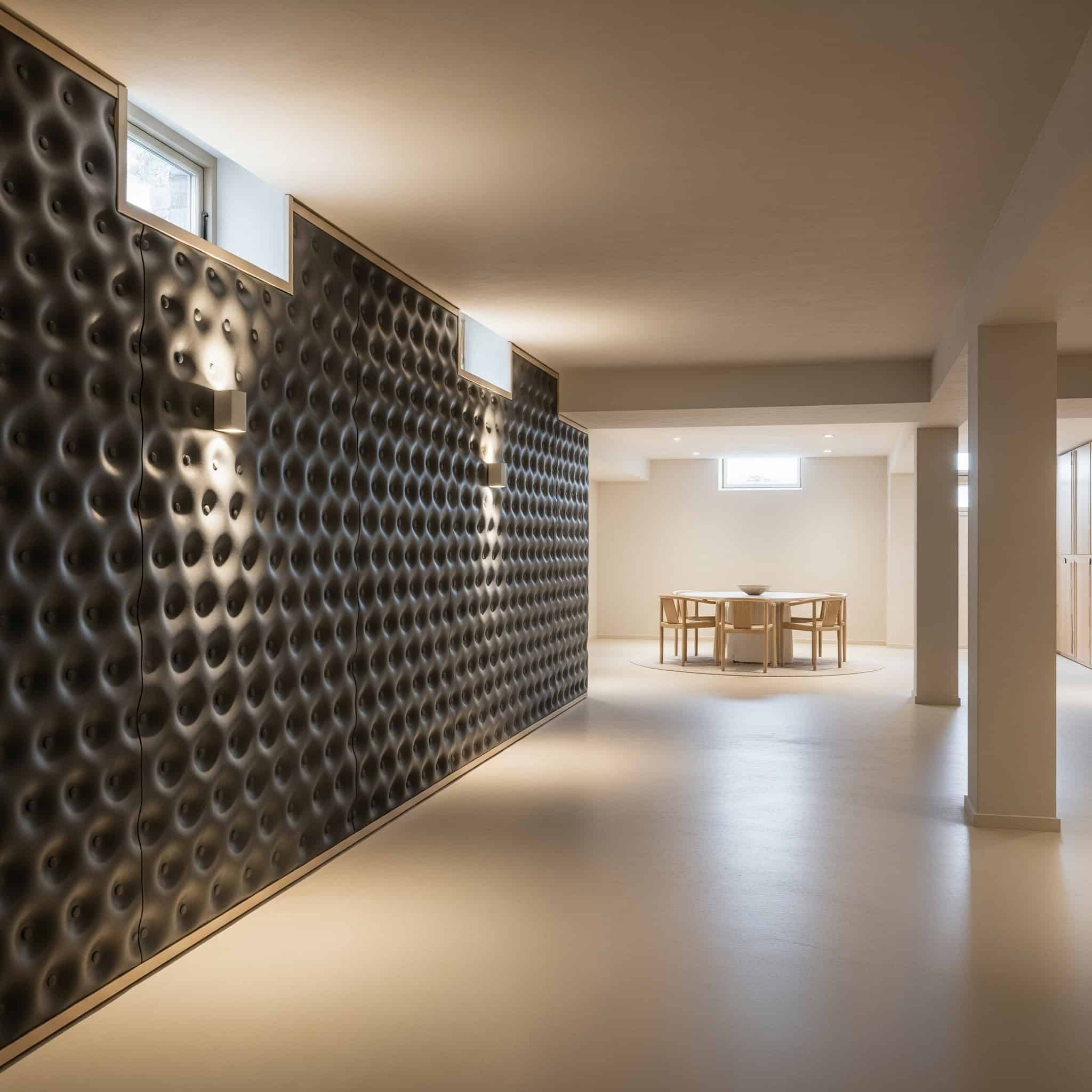 A modern 2025 basement wall with a dimpled membrane system