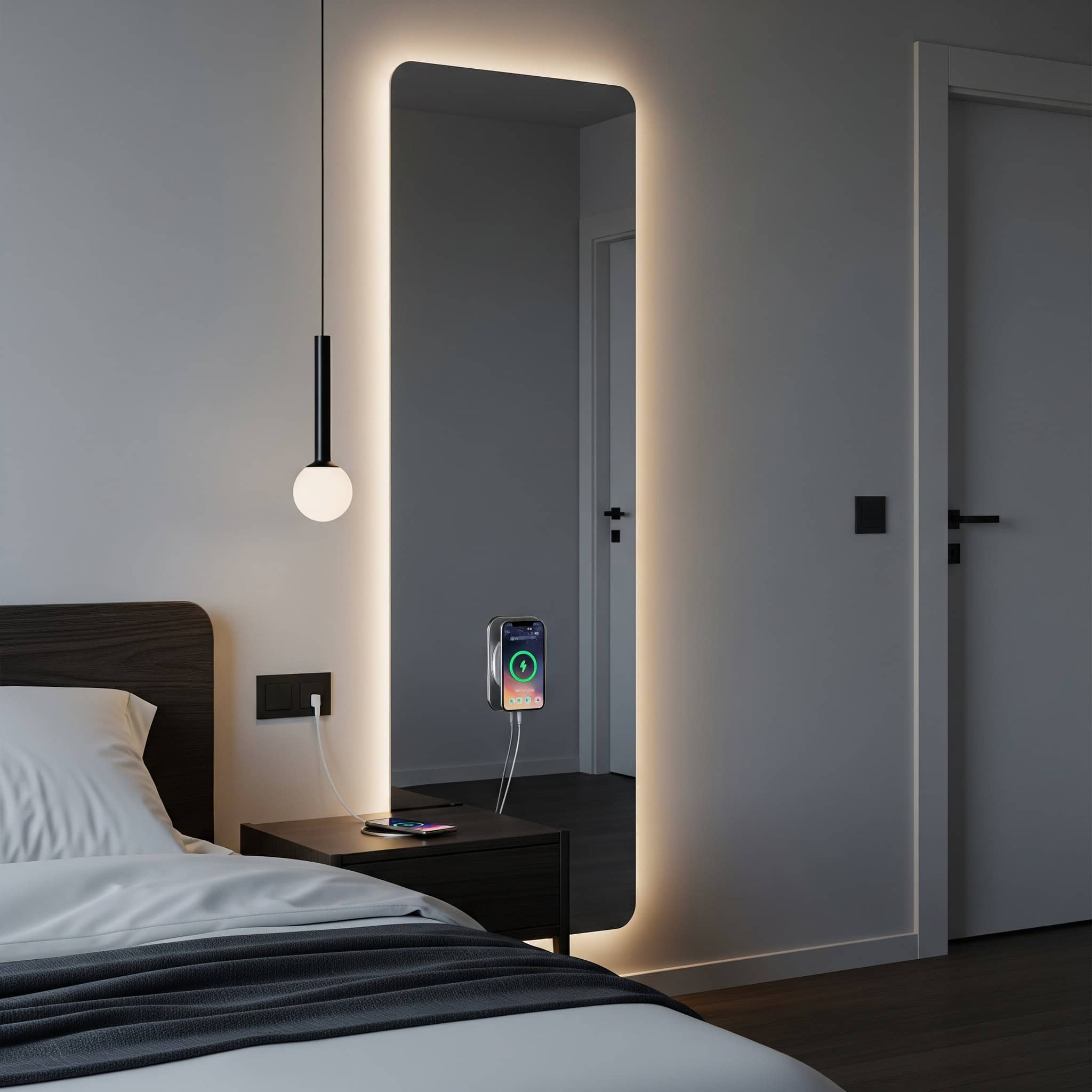 Bedroom with a mirror with integrated lighting and a charging station.
