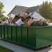 A professional, wide-angle photo of a green 15 cubic yard roll-off dumpster filled with household debris on a residential driveway, illustrating the size dimensions and capacity available for rental from JiffyJunk.com.