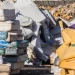 Image of stack of old mattresses and foam materials at a recycling and disposal site, showing affordable mattress recycling services near me with eco-friendly pickup options.