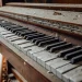 Image of an old piano ready for removal