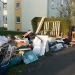 An image of free junk removal pickup with furniture and household clutter on the curb, showing options for getting rid of large items and junk removal near me