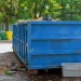 A view of a large 25 yard dumpster placed in a residential area for construction debris and household junk for dumpster rental.
