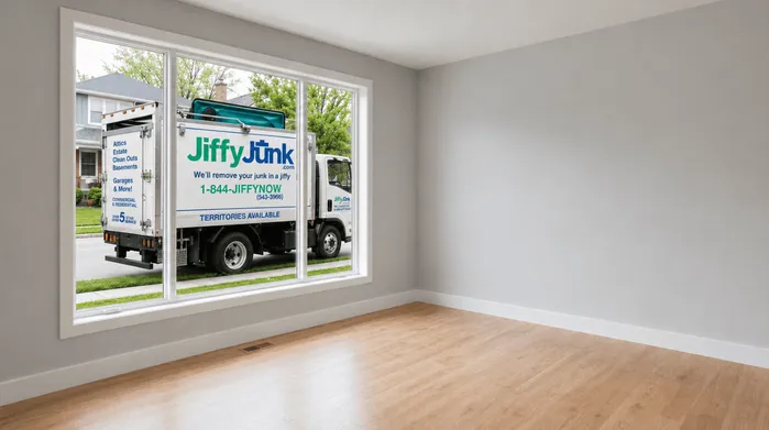 A bright, clutter-free living room staged for home sale, with a Jiffy Junk branded truck visible through the window, illustrating the connection between professional junk removal and a successful home listing.