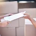 An image of a junk removal appointment with a customer signing paperwork, showing what to expect on pickup day and how to prepare for junk removal service