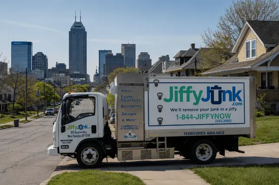 An image of a Jiffy Junk truck in Indianapolis, Indiana, representing professional junk removal services and local cleanout pricing for residential and commercial properties throughout the state.
