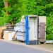 An image of curbside junk awaiting pickup by a junk removal crew.