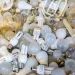 An image of fluorescent light bulbs and CFLs collected for recycling, illustrating how to dispose of fluorescent bulbs safely and handle mercury-containing light bulbs properly.