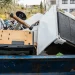 An image of a loaded dumpster illustrating dumpster rental vs junk removal in Boca Raton.